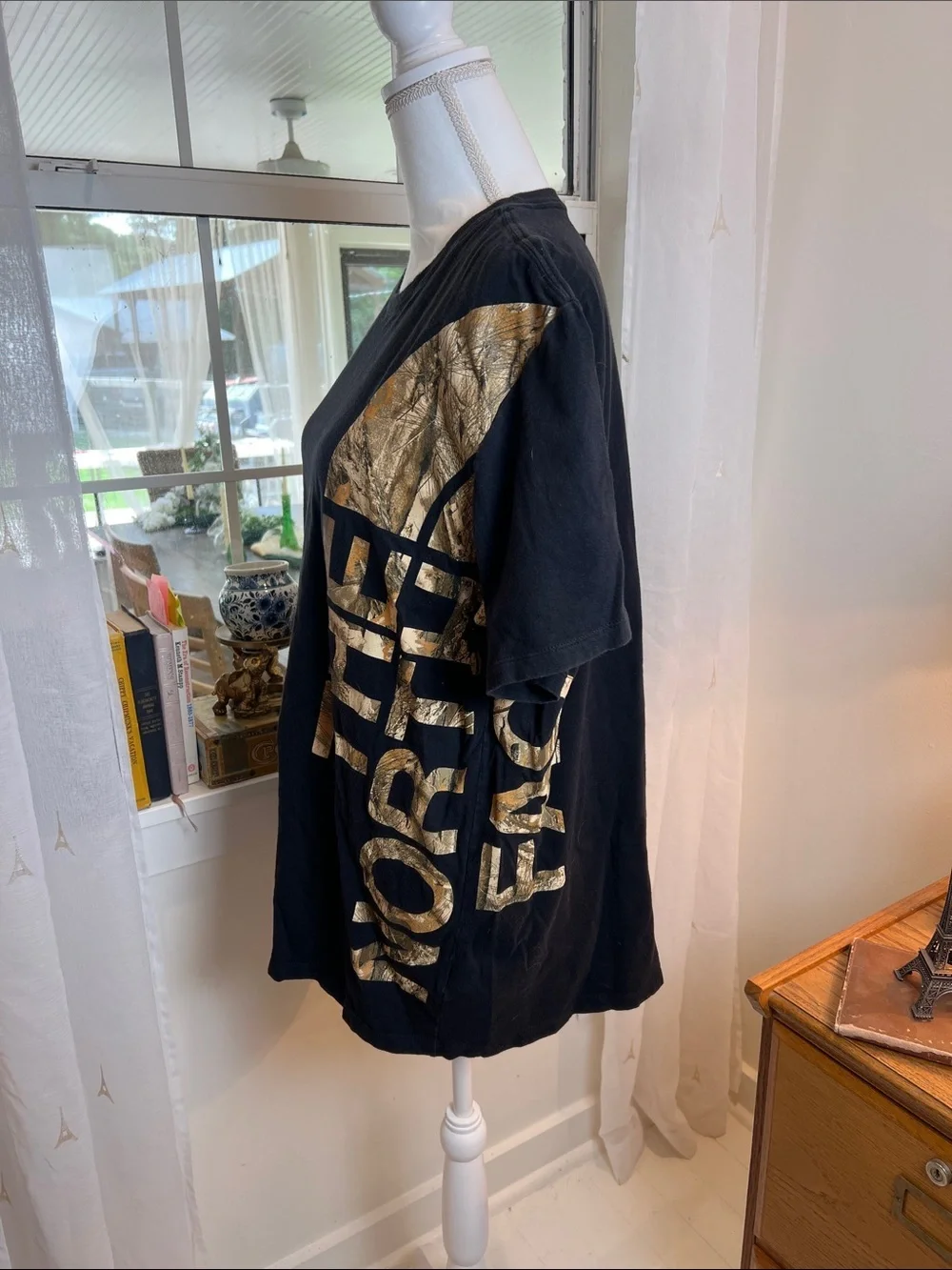 The North Face Black Tee with Gold Side Logo size XL.